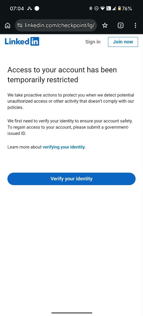 LinkedIn page saying access to my account has been temporarily restricted and asking me to submit a government-issued ID.